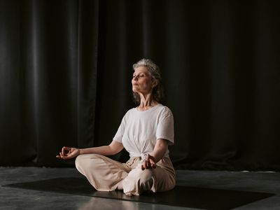 Close up of hands in a meditative mudra position.